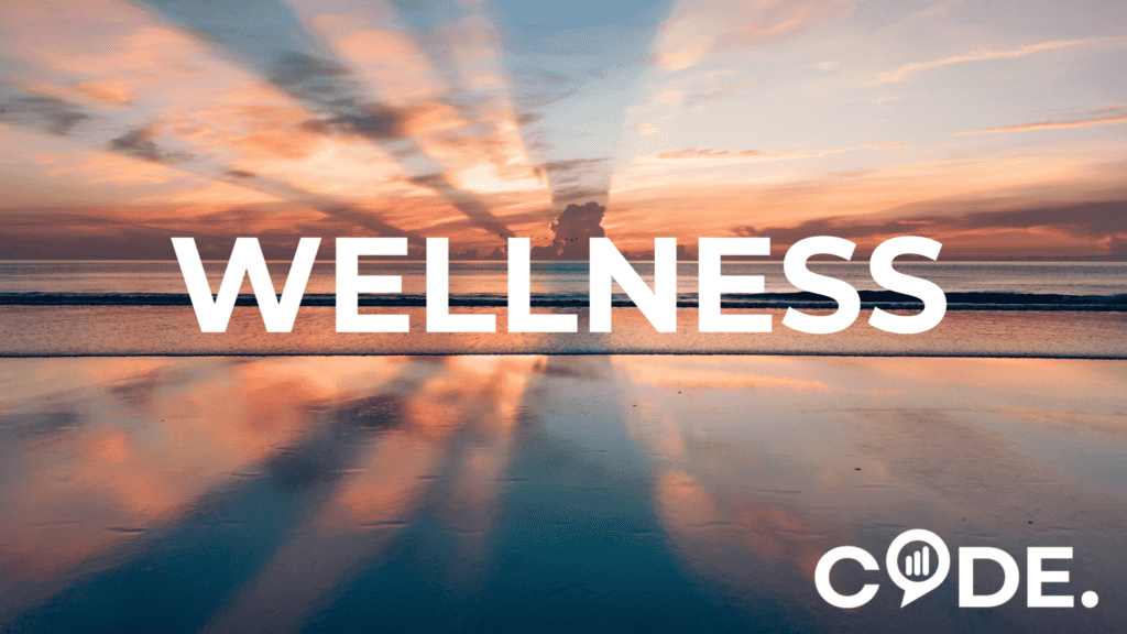 A visual image of a sunset with the Code logo and the word "wellness" across the image
