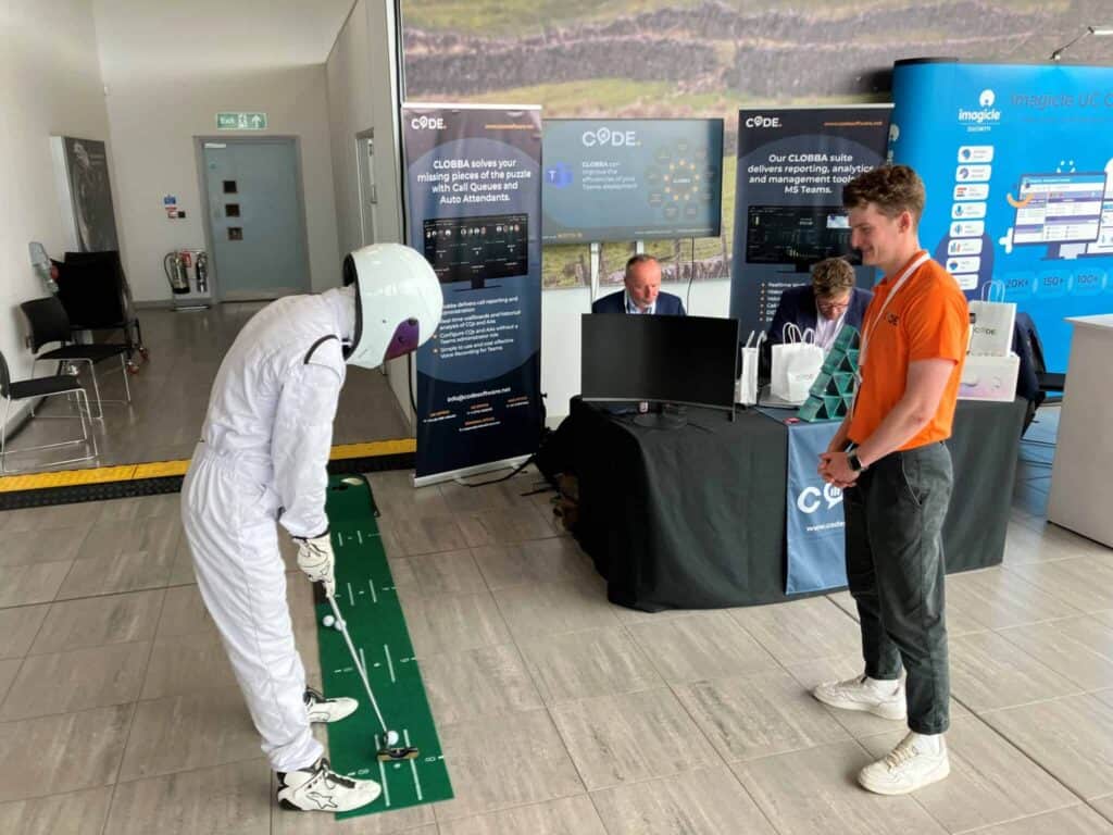 Image of code software at a trade show with their game of golf putting
