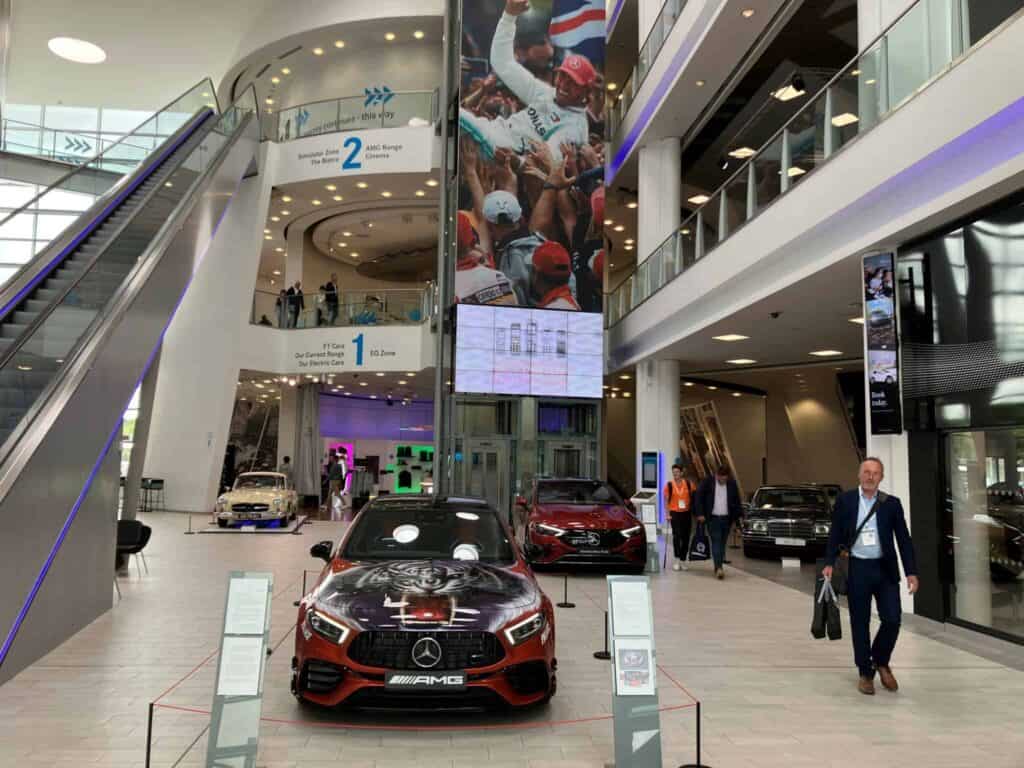 Image of a car dealership showing different cars including Mercedes